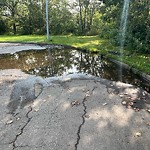 Pooling water due to Depression on Road at 12705 102 Avenue NW