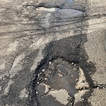 Potholes at 6131 101 Avenue NW