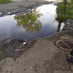 Pooling water due to Depression on Road at 10620 112 St Nw, Edmonton, Ab T5 H 3 G8, Canada