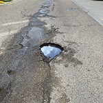 Potholes at 9945 108 Street NW