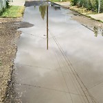 Pooling water due to Depression on Road at 4853–4899 124 Ave Nw, Edmonton T5 W 5 H5