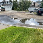 Pooling water due to Depression on Road at 11336 10 Avenue NW