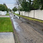 Pooling water due to Depression on Road at 8707 41 Avenue NW