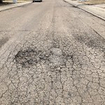 Potholes at 10820 33 Ave NW