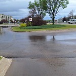 Pooling water due to Depression on Road at 100 Clareview Transit Station NW