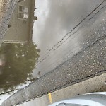 Pooling water due to Depression on Road at 9929 Saskatchewan Drive Condo Corp, 9929 Saskatchewan Dr Nw, Edmonton T6 E 5 J9