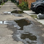 Pooling water due to Depression on Road at 10991 129 Street NW