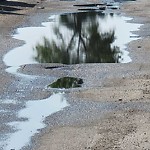 Pooling water due to Depression on Road at 11255 117 Street NW