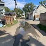 Pooling water due to Depression on Road at 10833 128 Street NW