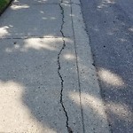 Sidewalk Concern at 309 Grand Meadow Crescent NW