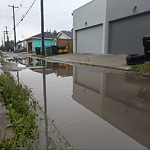 Pooling water due to Depression on Road at 9747 73 Avenue NW