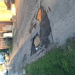 Potholes at 9611 77 Ave NW