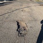 Potholes at 16404 100 Avenue NW